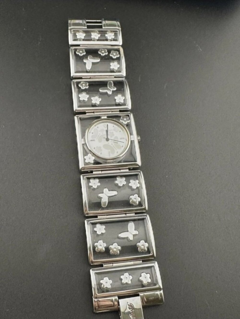 Brighton Gainesville watch features a design silver-tone butterflies & flowers.